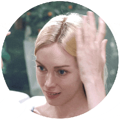 Woman splitting her hair so she can apply Cosmerna