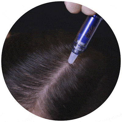 Man applying CosmeRNA onto his scalp.